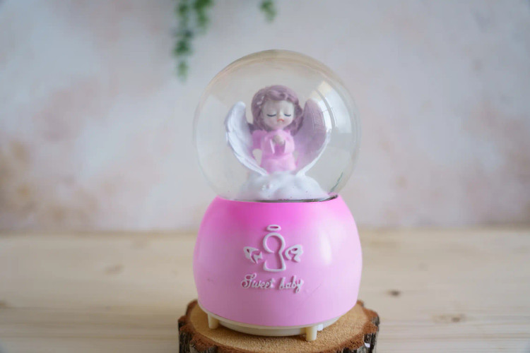 گوی موزیکال پمپی بزرگ دارای ۸موزیک و ۸رقص نور طرح فرشته صورتی