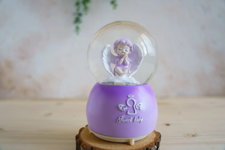 گوی موزیکال پمپی بزرگ دارای ۸موزیک و ۸رقص نور طرح فرشته بنفش